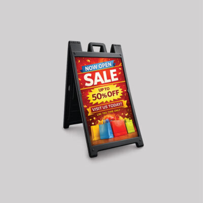 Black plastic A-frame sidewalk sign promoting retail store grand opening sale